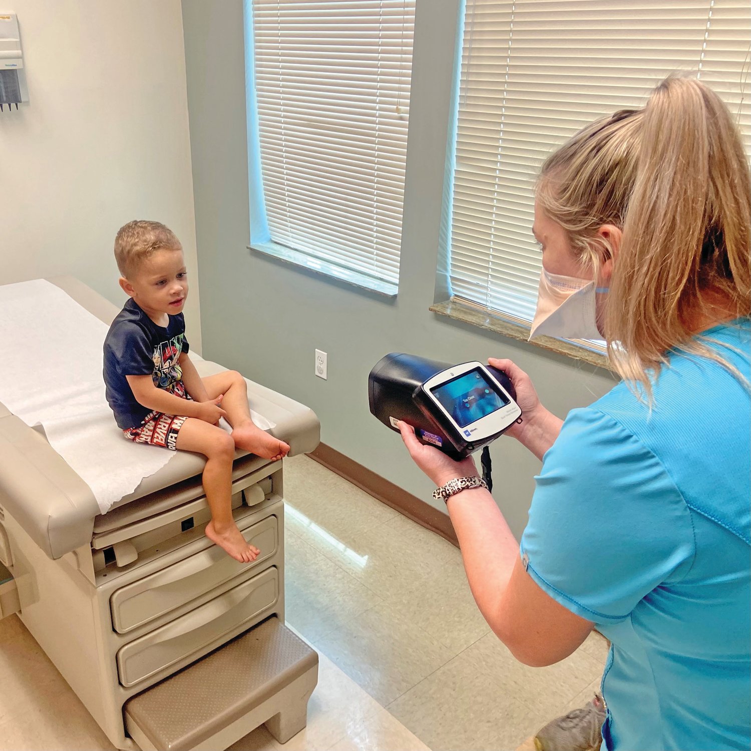 Pediatric Patient Gunner Burke receiving their vision test with the new Spot Vision Screener donated by the Dr. Martha E. Valiant M.D. Foundation.